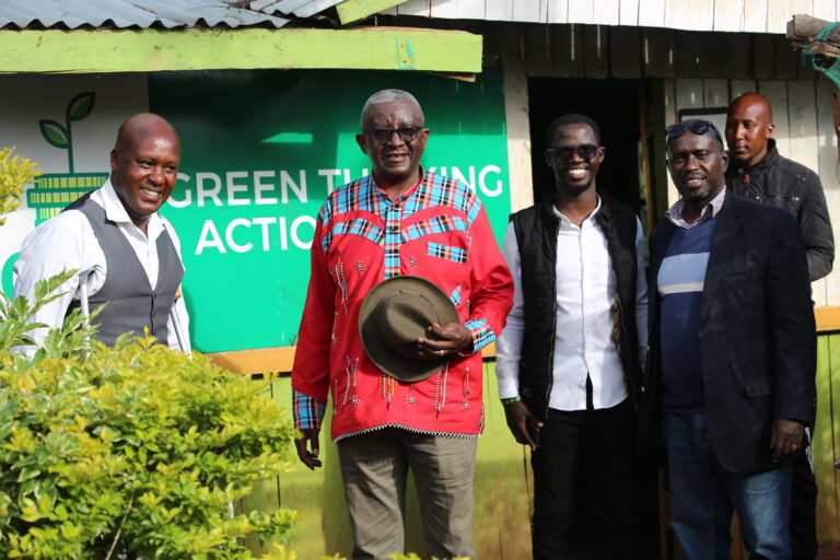 Dr Kalua Green and party members pose for a photo outside offices